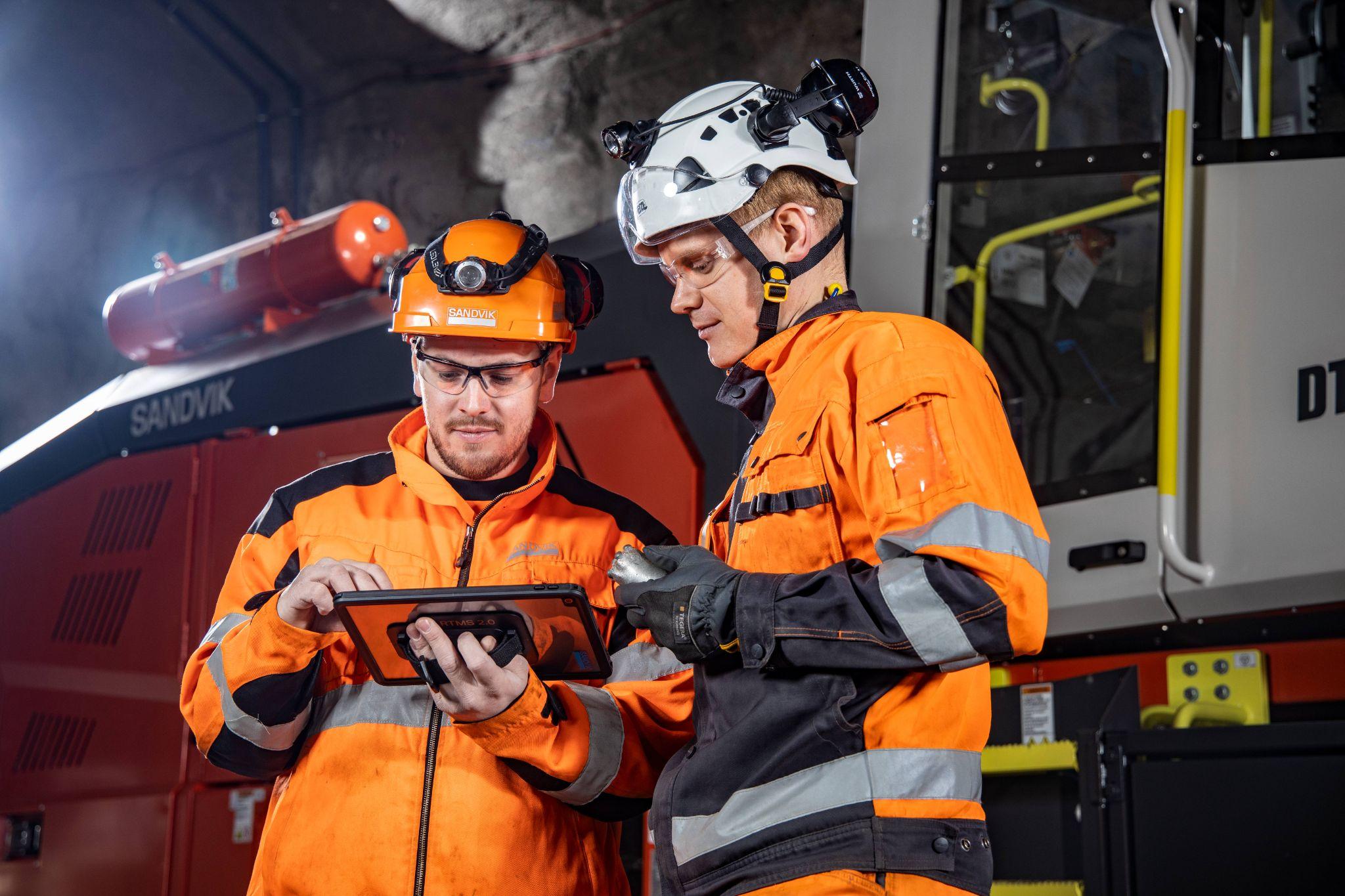 Workers using a tablet